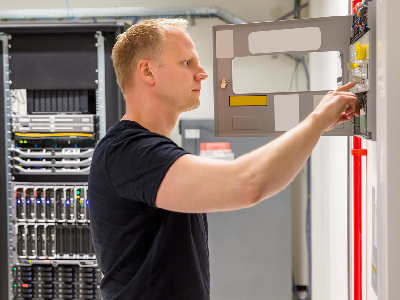 man inspecting electrical panel